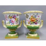 A pair of Bloor Derby green ground campana urn vases, twin handled and with hand painted floral
