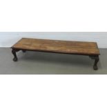 Low hardwood table with cabriole legs with ball and claw feet, 151 x 31 x 49cm