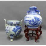 Two Chinese blue and white vases / jars, one with a shaped hardwood stand, taller 31cm (2)