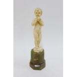 Ferdinand Preiss (1882-1943) Art Deco ivory figure of a boy holding an apple, signed and standing on