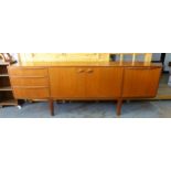 McIntosh mid century teak sideboard, rectangular top over a pair of central doors with shelved