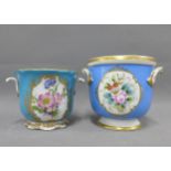 Continental porcelain cache pot with blue ground and painted with flowers together with another,