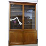 Large Victorian bookcase cabinet, cornice top above a pair of glazed doors with a shelved