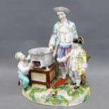 Meissen style chestnut roasting figure group, restored in the base, 28cm