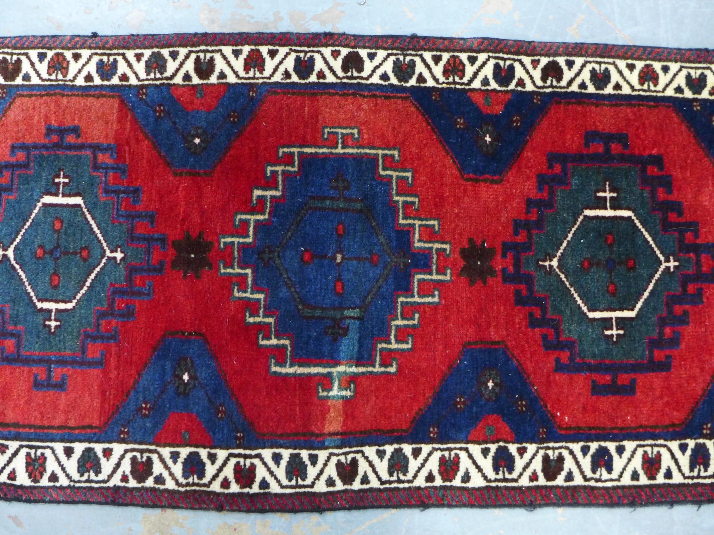 Kazak style runner with red field and seven medallions, 290 x 74cm - Image 3 of 5