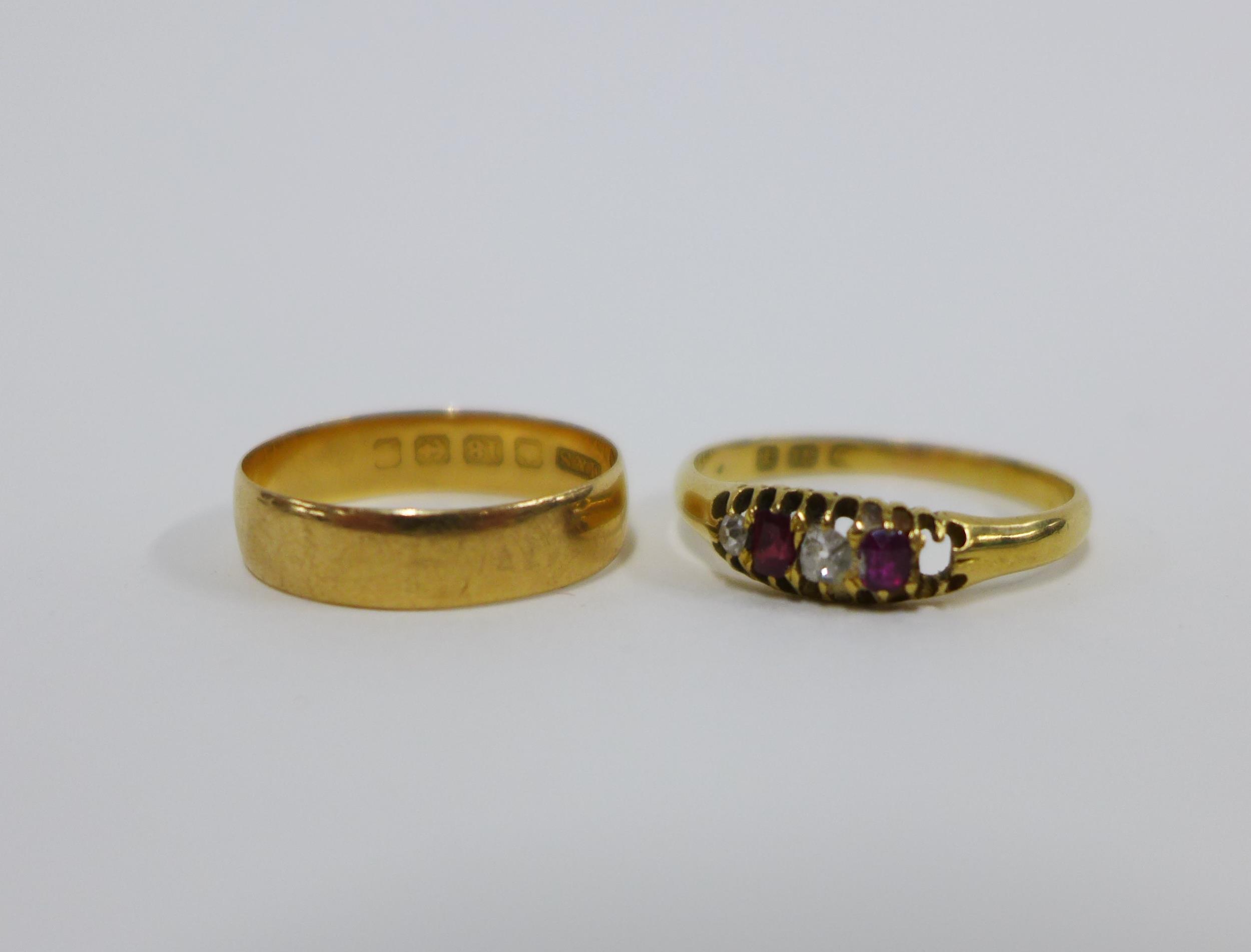 18ct gold wedding band and an 18ct gold diamond and ruby ring (one stone lacking) (2)