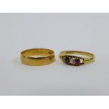 18ct gold wedding band and an 18ct gold diamond and ruby ring (one stone lacking) (2)