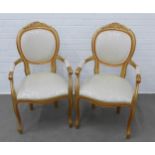 A pair of modern French style open armchairs with stuff over upholstered damask seats, 58 x 101cm (