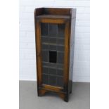 Early 20th century oak bookcase of small proportions, with leaded glazed door - one panel lacking,
