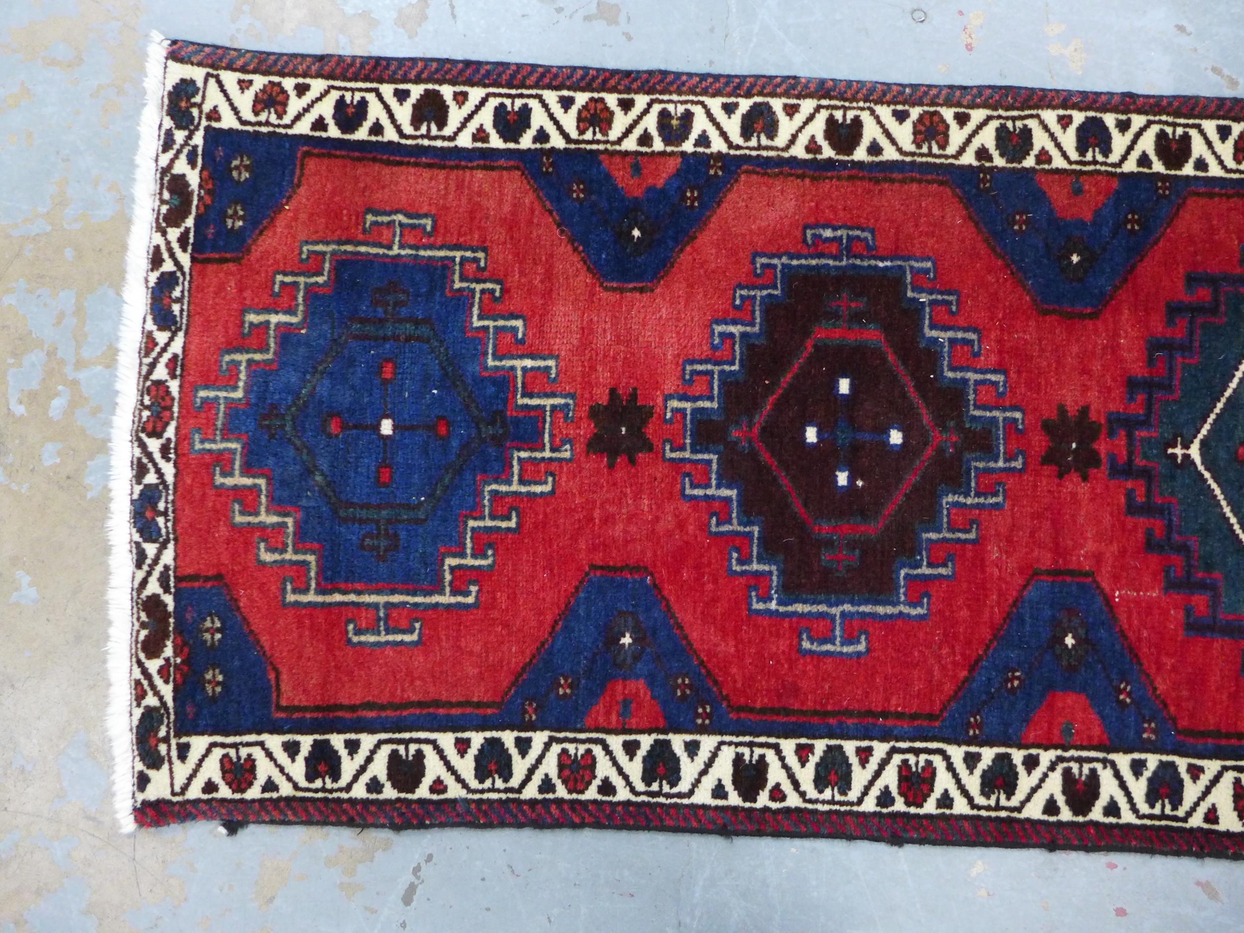 Kazak style runner with red field and seven medallions, 290 x 74cm - Image 4 of 5