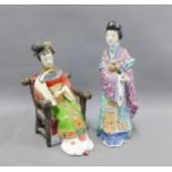 Chinese famille rose figure of a woman together with another, taller 26cm (2)