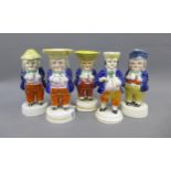 Group of five Staffordshire and Scottish pottery figures, one with a cruet top, 14cm (5) (a/f)