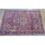 Late 19th / early 20th century Kirman rug, central Persia, raspberry field with light blue