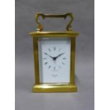 Comitti, London brass and glass panelled carriage clock, 15cm high including handle