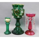 Bohemian green glass table lustre, smaller cranberry glass table lustre and a green glass vase,