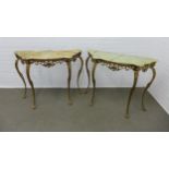 A pair of vintage console tables, with serpentine tops and raised on faux brass cabriole legs with