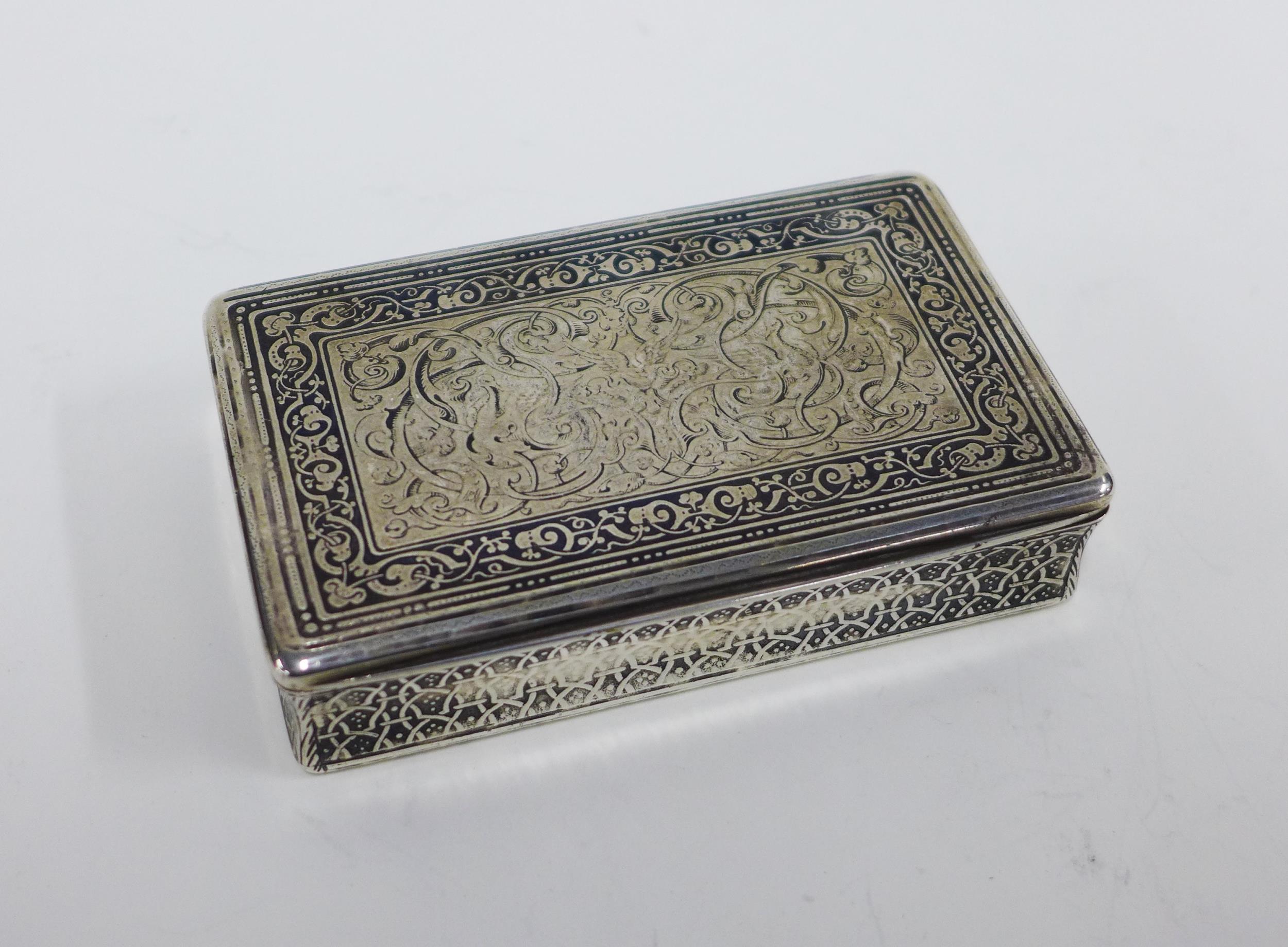 19th century European white metal table snuff box, with a silver gilt interior, niello work and