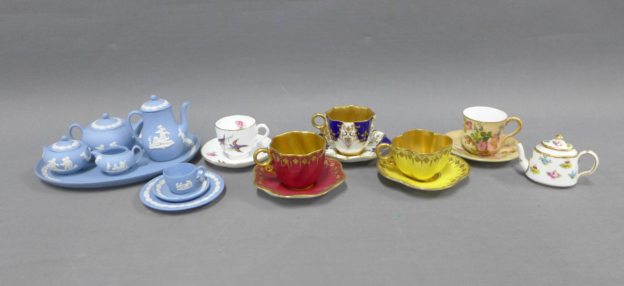 Collection of miniature porcelain cabinet cups and saucers to include Coalport, Royal Worcester