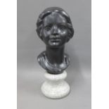 Black pottery head and shoulders bust on a faux hardstone socle base, 35cm