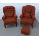 Two armchairs and a footstool in matching red upholstery, larger chair 76 x 106 x 48cm (3)