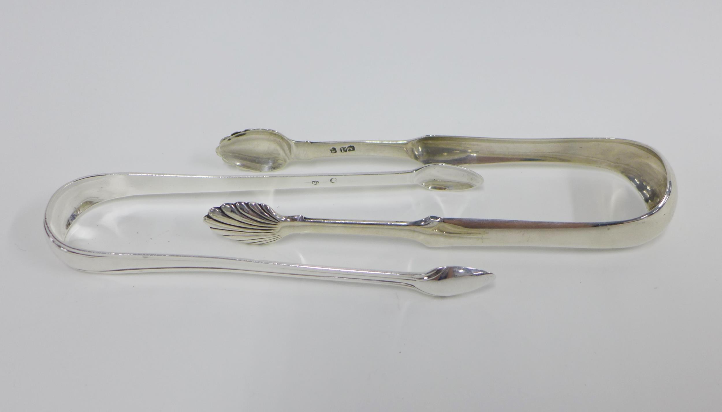 George III Scottish silver sugar tongs c1790 likely by James Wemyss and another set with shell bowls