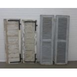 One pair of vintage blue painted window shutters (44 x 158cm), together with two other white painted