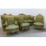 French rococo revival style parlour suite, gilt framed with pale green damask upholstery with loose