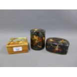 Two black lacquered papier mache boxes and another, tallest 11cm (3)