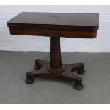 Early 19th century rosewood foldover games table, green lined, on a tapering pedestal and platform