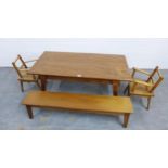 An early 20th century artisan made child's dining set comprising a long table with rectangular