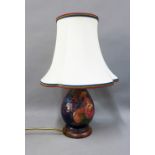 Moorcroft 'Bullfinch' pattern table lamp base, on wooden stand, complete with shade, 22cm