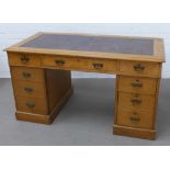 Late 19th century oak pedestal desk, the rectangular top with a red skiver, over an arrangement of