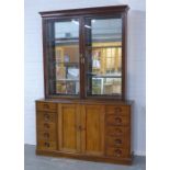 19th century mahogany bookcase cabinet, the cornice above a pair of glazed doors with a shelved