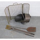 Three piece brass and steel fireside companion set with gilded owl handles, bronze patinated coal