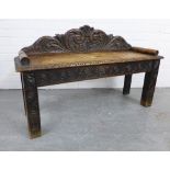 Carved oak window seat with a scrolling toprail, solid seat and straight square legs, 107 x 65cm