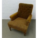Late 19th / early 20th century button back upholstered armchair, with sloping back and curved