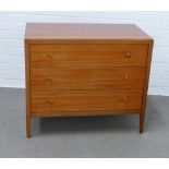 Mid century Loughborough Furniture teak chest with three long drawers with stylised brass handles,
