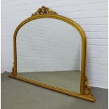 Giltwood overmantle, scroll carved top and bevelled glass plate, 144 x 105cm