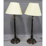 A pair of mahogany spiral twist column table lamps with brass caps and fittings, 55cm excluding
