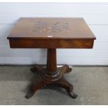 Mahogany games table, rectangular top and two drawers, on a tapering column and platform base with