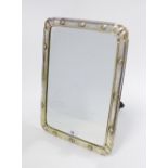 Victorian silver framed mirror with bright cut engraved pattern and twelve embossed roundels, with a