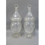 A pair of Georgian glass confitures with covers, on octagonal bases, 33cm (2)