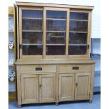Pine dresser, cornice top over three glazed doors with a shelved interior above two drawers and pair