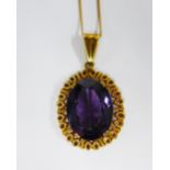 18ct gold gemset pendant on an 18ct gold chain