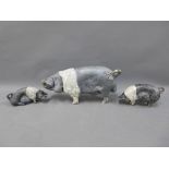 Raku glazed and fired Saddleback pig, signed indistinctly, 27cm long (ear restored)and two smaller