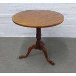 Mahogany pedestal table, circular top on a single column with tripod legs, terminating on pad