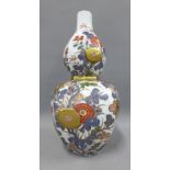 Japanese double gourd vase of octagonal form, double walled with pierced chrysanthemum panels and
