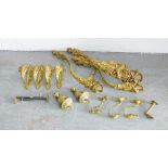 A collection of ormolu curtain tiebacks, hooks and finials (a lot)