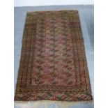 Bokhara rug, red field with three rows of thirteen guls, 116 x 180cm