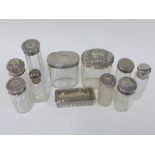 19th / 20th century silver mounted glass dressing table jars and boxes, nine with various makers and